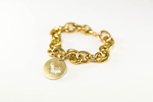 Small oval link bracelet (7.5" long) shown in brass with St. Barth border with matte finish. 