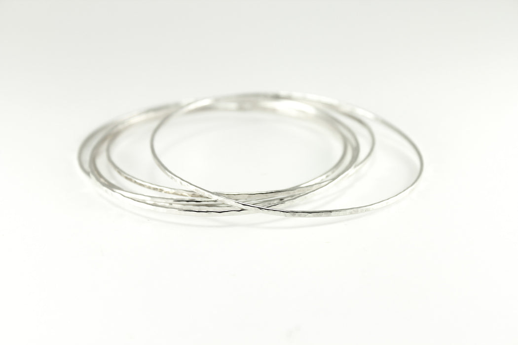 Sterling SIlver Hammered Solo Bangles. Approximately 1.25mm wide and thick.